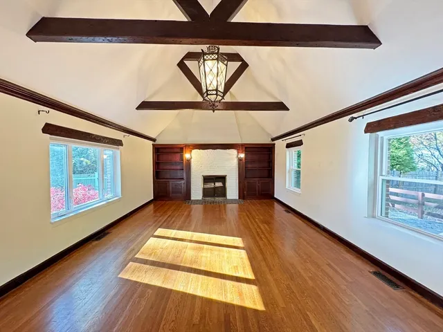 a view of an entryway with wooden floor