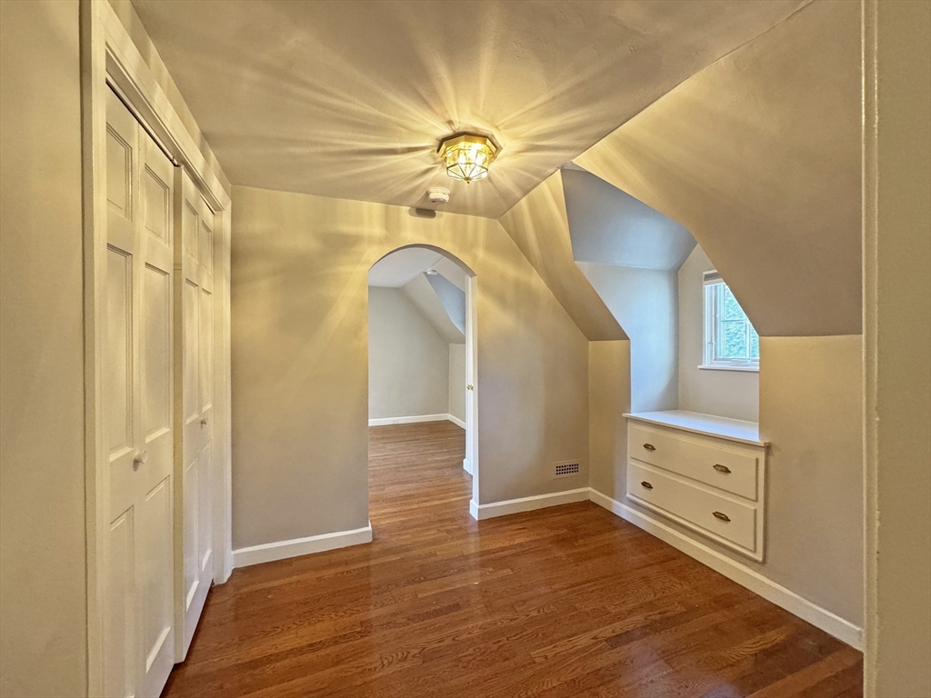 280 Quinobequin Road Newton, MA 02468 - Photo 22 of 31 a view of a livingroom with a fireplace