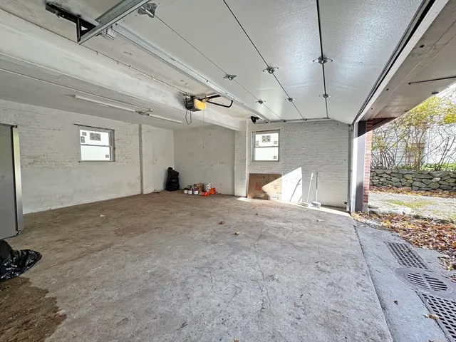 a view of a room with window and hardwood floor