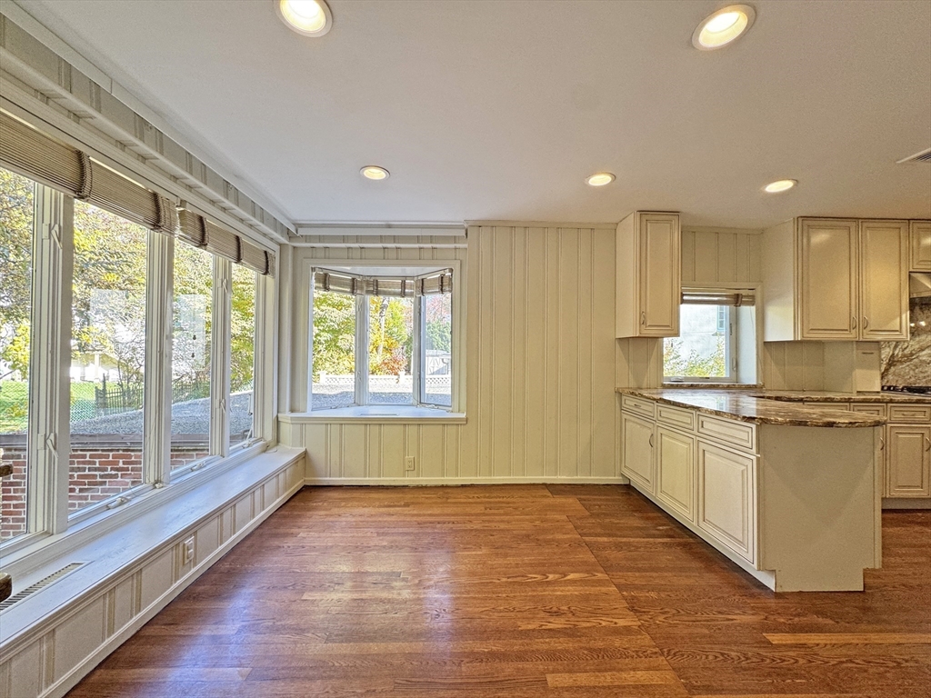 280 Quinobequin Road Newton, MA 02468 - Photo 6 of 31 a kitchen with a sink wooden floor and window