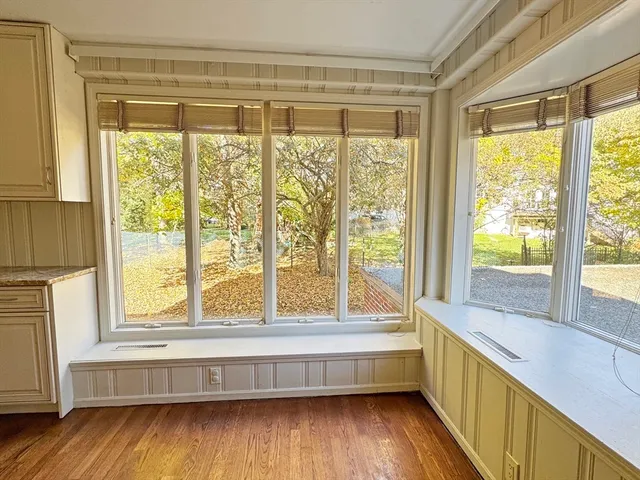 a bathroom with a large window and a bathtub