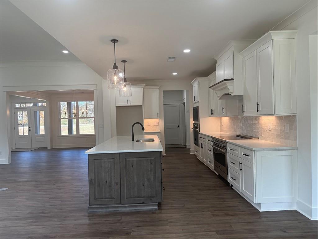 1723 Darby Road Waleska, GA 30183 - Photo 12 of 29 a large kitchen with stainless steel appliances granite countertop a stove a sink and a refrigerator