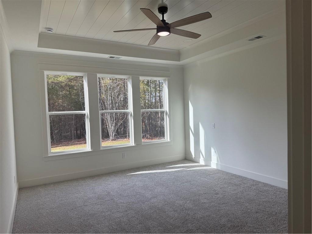 1723 Darby Road Waleska, GA 30183 - Photo 13 of 29 an empty room with a window and a ceiling fan