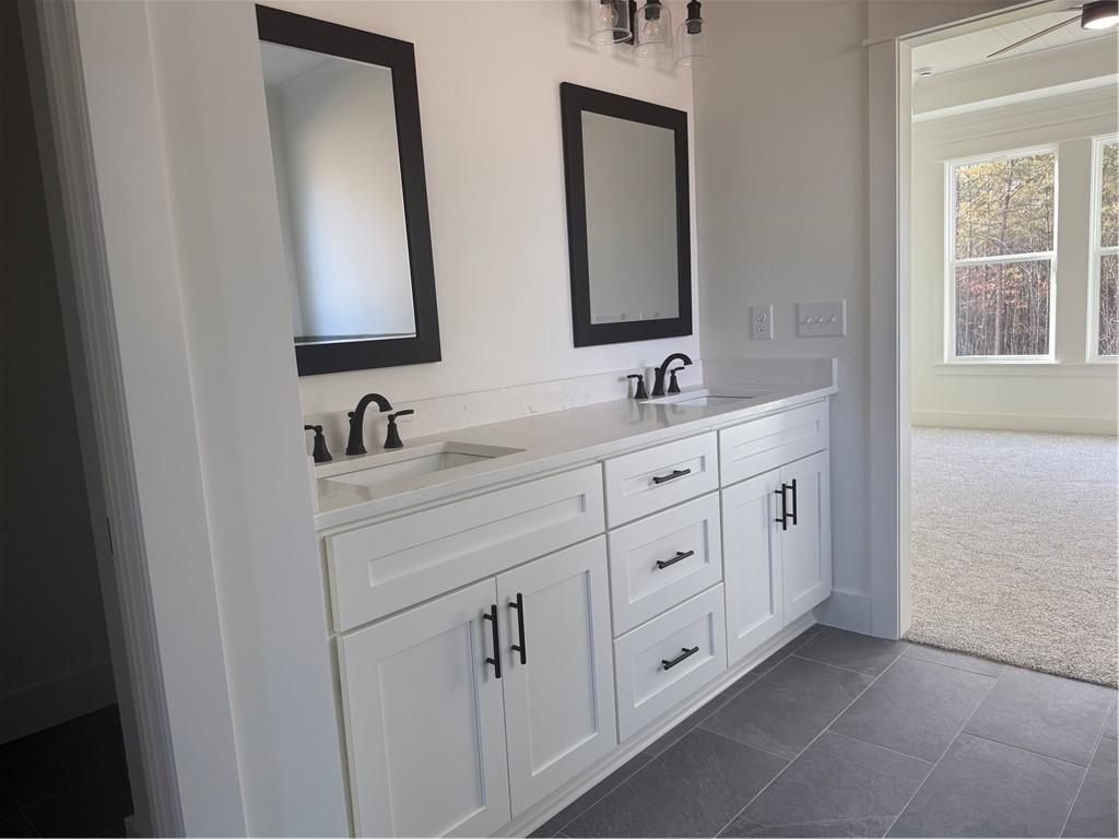 1723 Darby Road Waleska, GA 30183 - Photo 17 of 29 a bathroom with double vanity sink a two mirror a window and a mirror