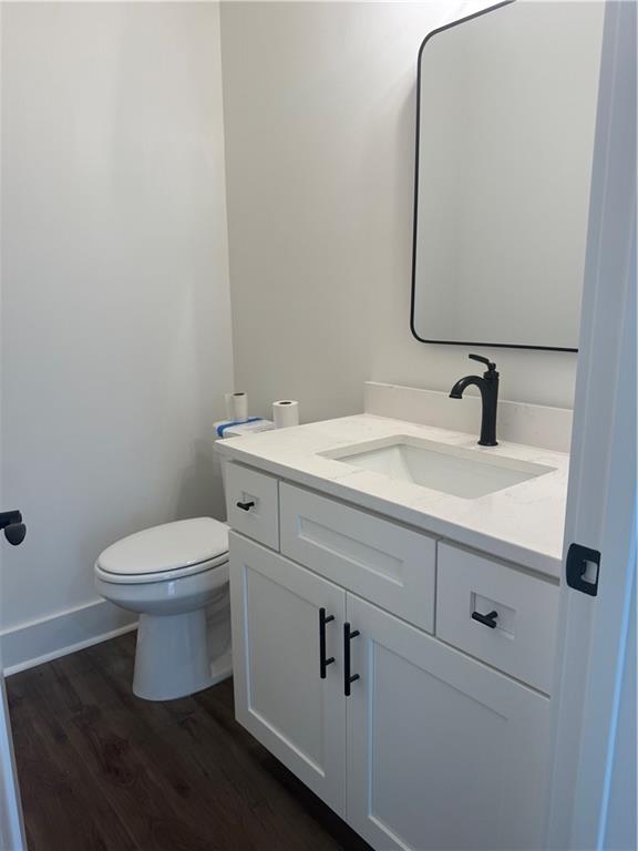 1723 Darby Road Waleska, GA 30183 - Photo 29 of 29 a bathroom with a toilet sink and mirror
