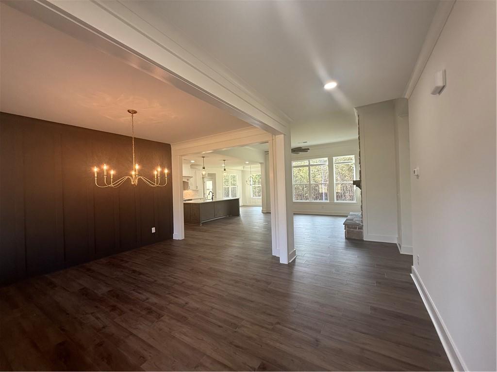 1723 Darby Road Waleska, GA 30183 - Photo 3 of 29 a view of an empty room with wooden floor and a window
