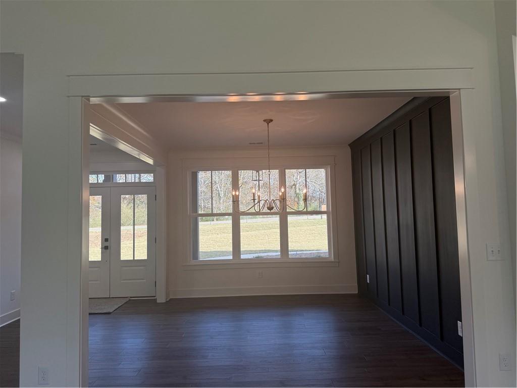 1723 Darby Road Waleska, GA 30183 - Photo 5 of 29 a view of an empty room with wooden floor and a window