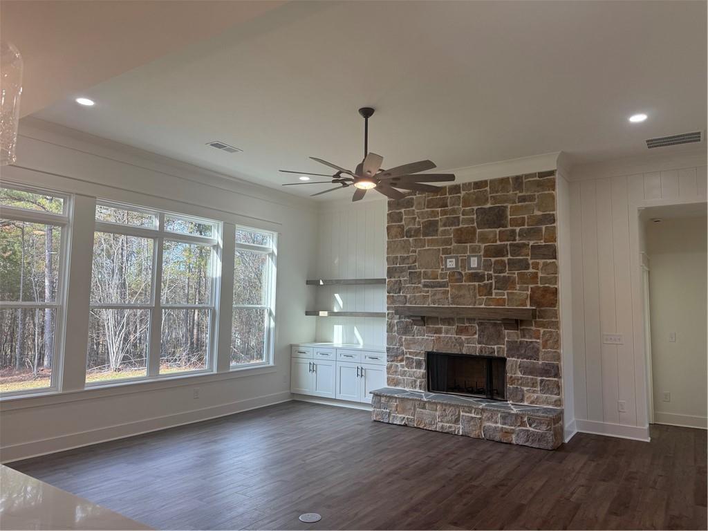 1723 Darby Road Waleska, GA 30183 - Photo 6 of 29 a view of an empty room with wooden floor fireplace and a window