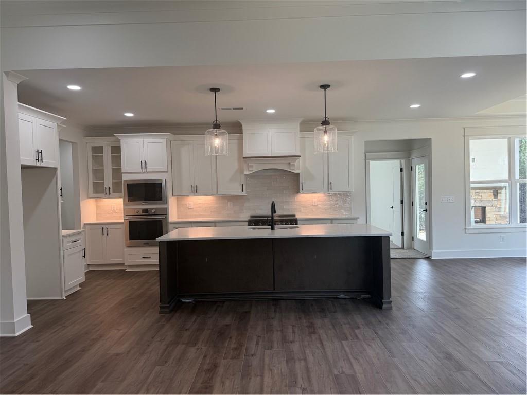1723 Darby Road Waleska, GA 30183 - Photo 9 of 29 a large kitchen with granite countertop a large counter top stainless steel appliances and wooden floor