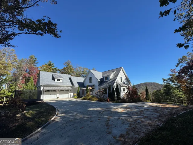 a view of residential houses with outdoor space