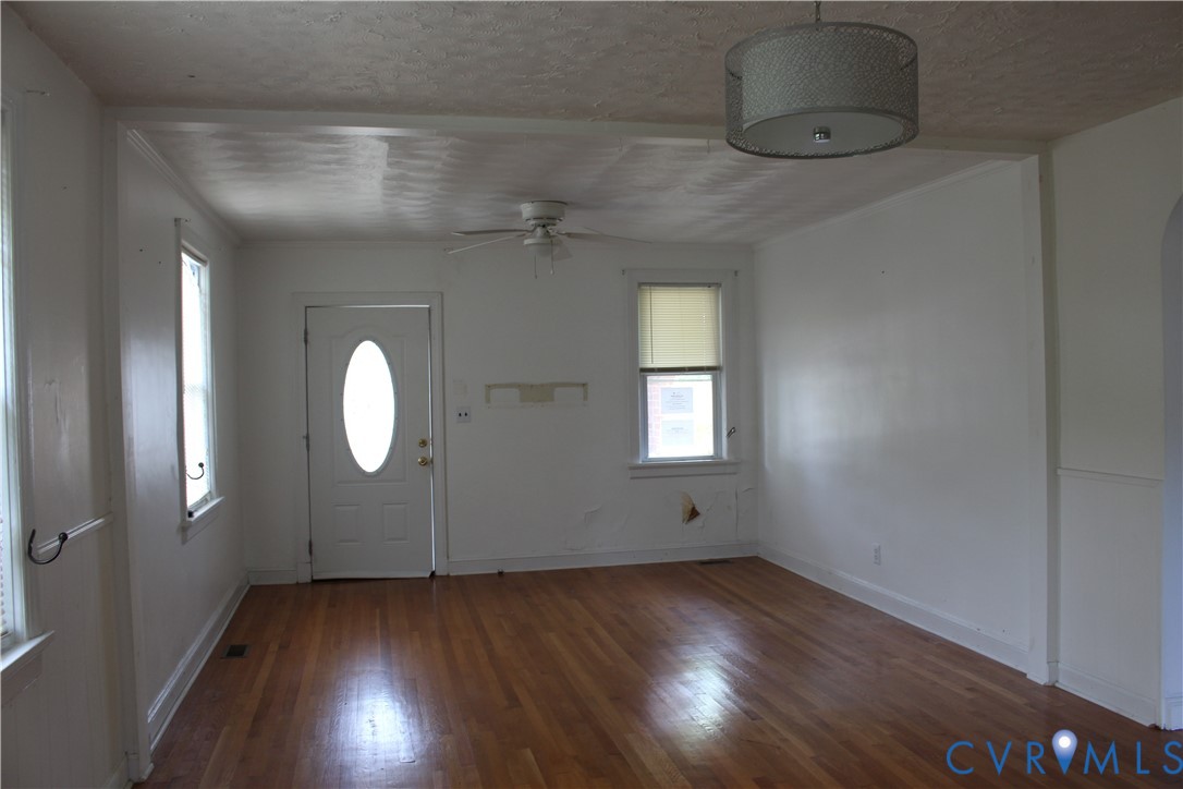 710 Colonial Avenue Colonial Heights, VA 23834 - Photo 5 of 14 an empty room with wooden floor and windows