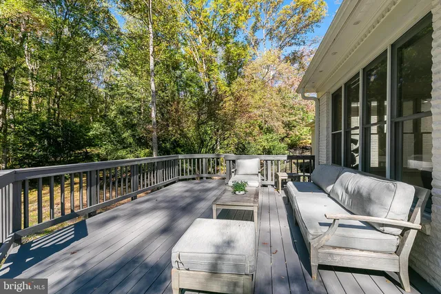 a view of balcony with furniture and wooden deck
