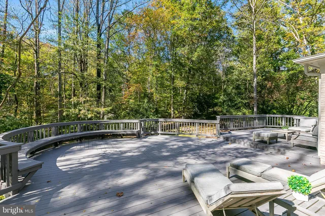 a view of backyard with a table and chairs