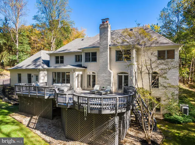a front view of a house with yard porch and furniture