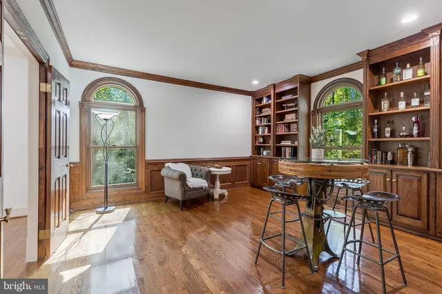 a very nice looking room with lots of furniture and a large window