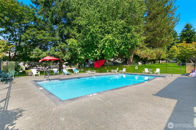 a view of a house with backyard sitting area and garden