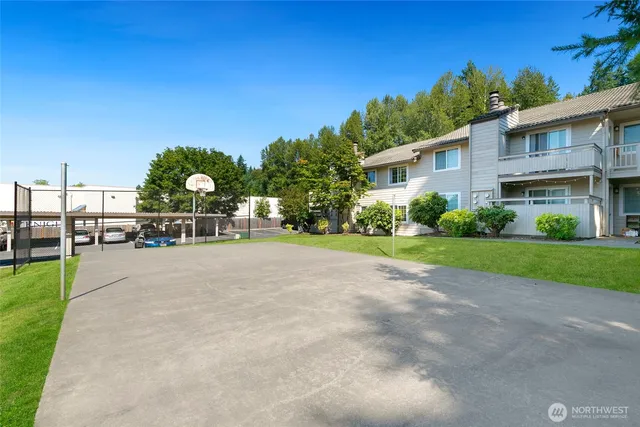 a front view of a house with a yard and a garage