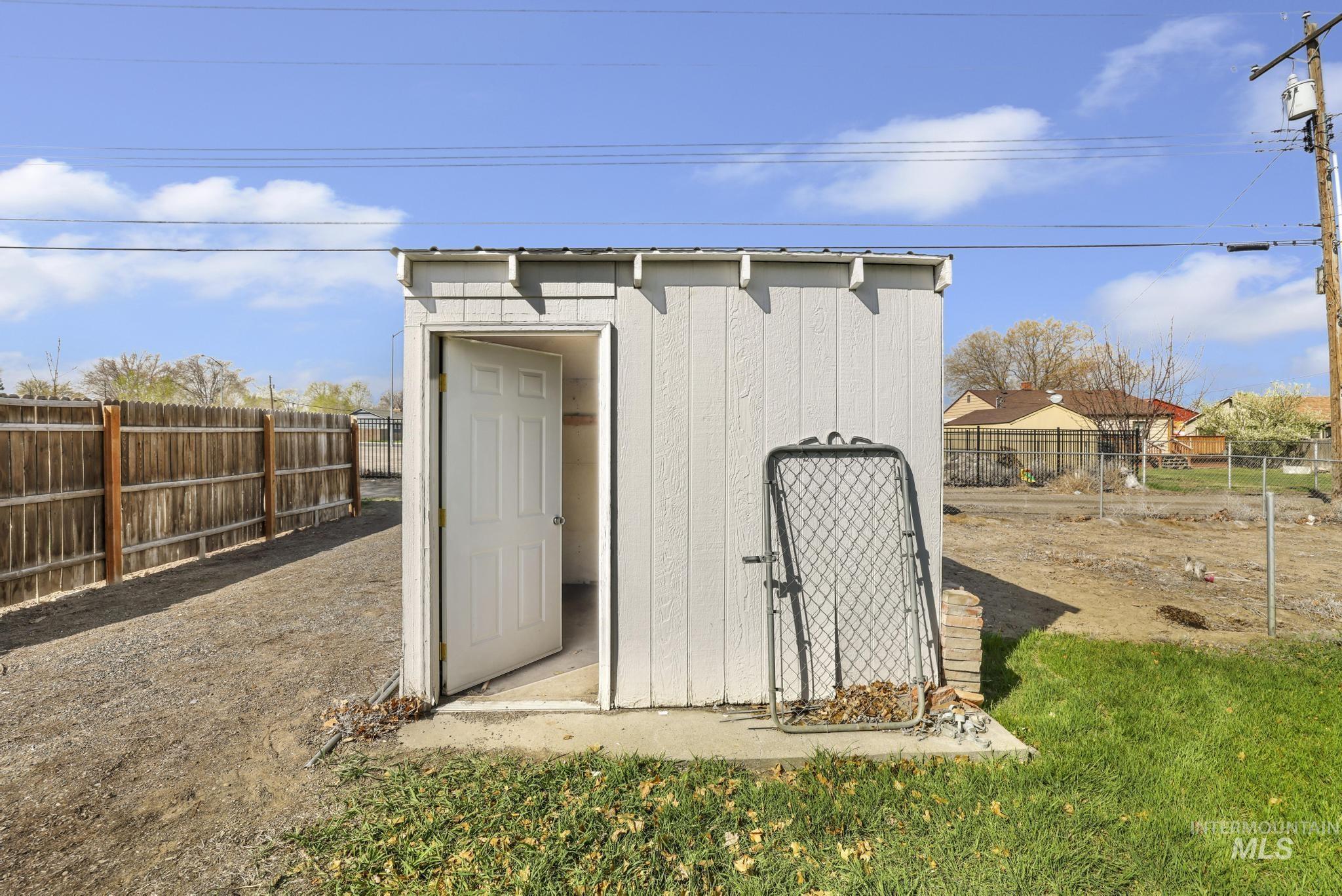 415 Adams Street Twin Falls, ID 83301 - Photo 16 of 20 View of shed featuring a fenced backyard
