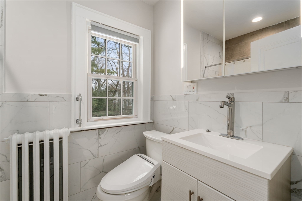 15 Gammons Road Newton, MA 02468 - Photo 13 of 20 a bathroom with a sink a toilet and a window