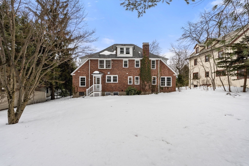 15 Gammons Road Newton, MA 02468 - Photo 20 of 20 a front view of a house with a yard covered in snow