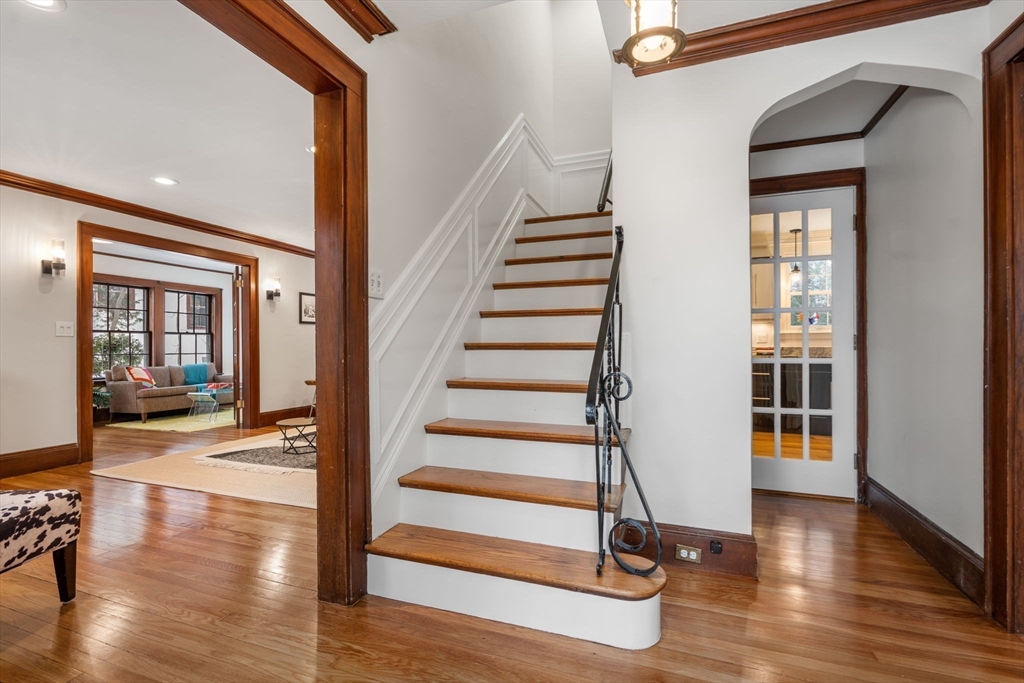 15 Gammons Road Newton, MA 02468 - Photo 2 of 20 a view of a living room with wooden floor and windows