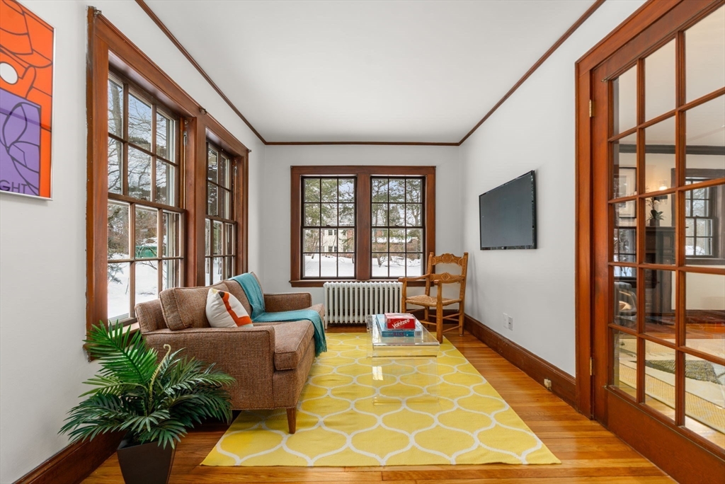 15 Gammons Road Newton, MA 02468 - Photo 4 of 20 a living room with furniture and a flat screen tv