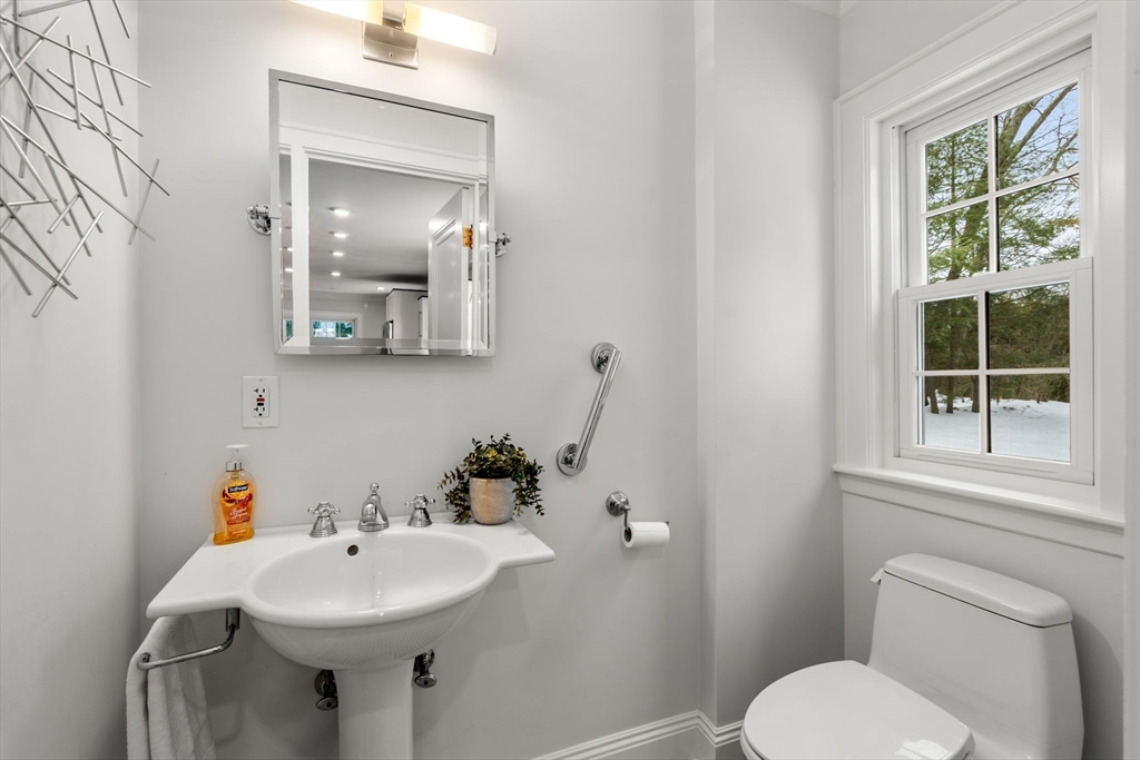 15 Gammons Road Newton, MA 02468 - Photo 7 of 20 a bathroom with a toilet sink and mirror