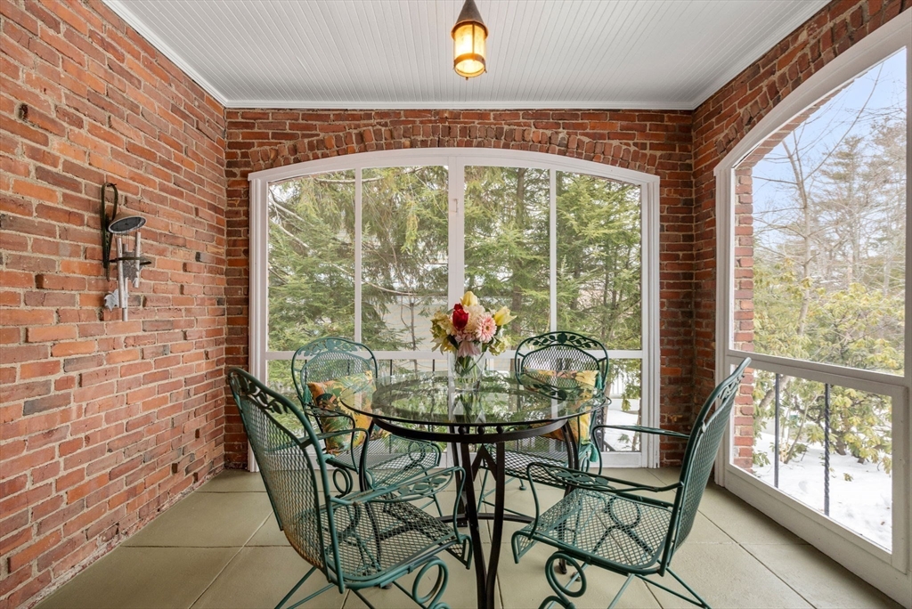 15 Gammons Road Newton, MA 02468 - Photo 8 of 20 a view of a dining room with furniture wooden floor and a potted plant
