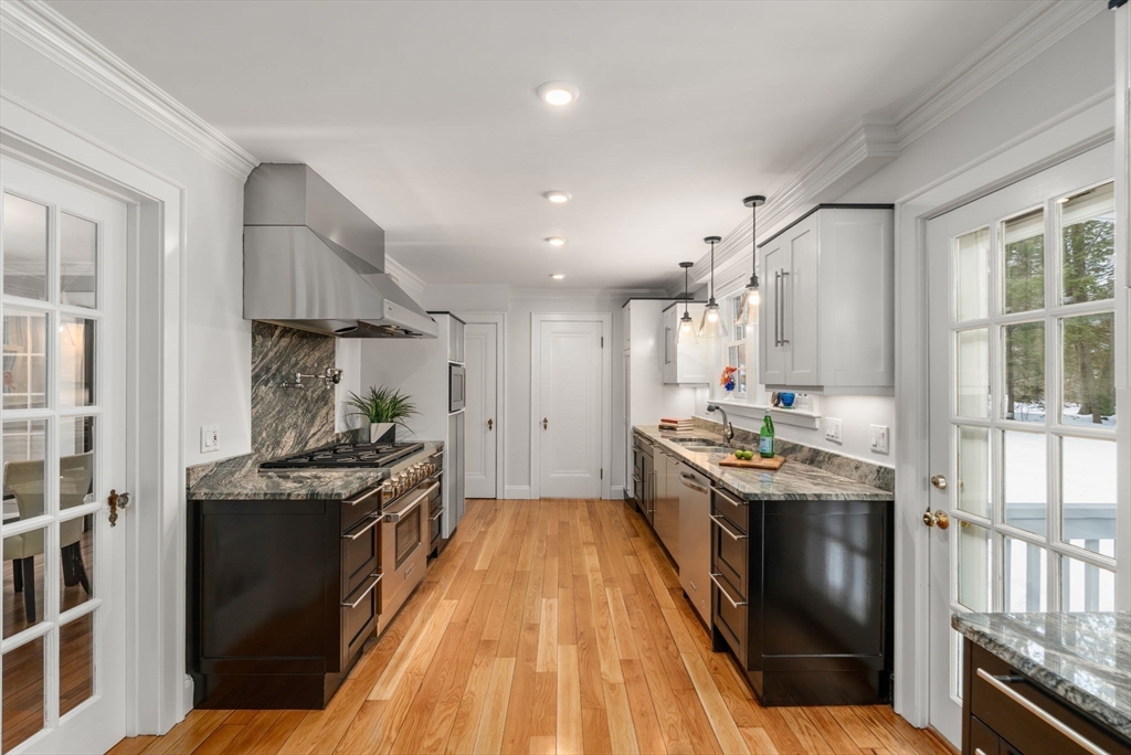 15 Gammons Road Newton, MA 02468 - Photo 9 of 20 a kitchen with stainless steel appliances granite countertop a stove and a sink