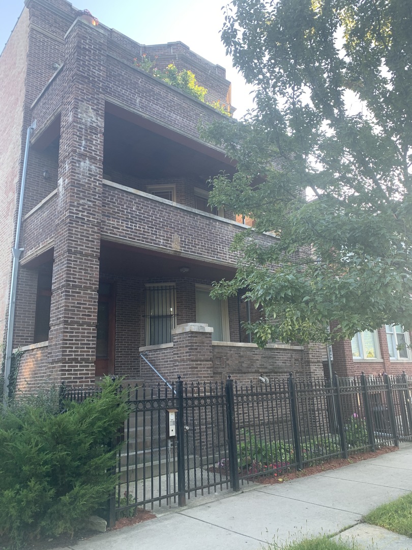 a view of a house with a iron gate