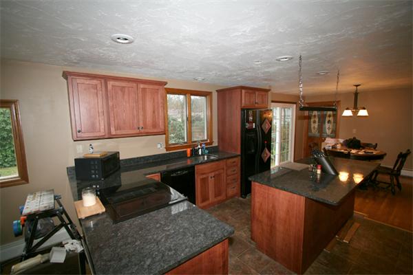 104 Ansel Howland Road Barnstable, MA 02632 - Photo 8 of 11 a living room with granite countertop furniture and a window
