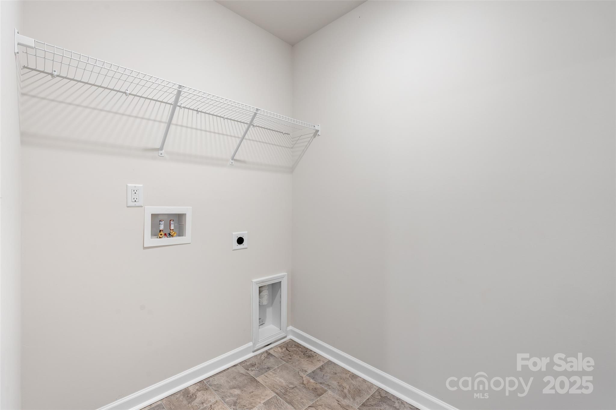 172 Callie River Clyde, NC 28721 - Photo 13 of 21 a view of a room with racks on the wall