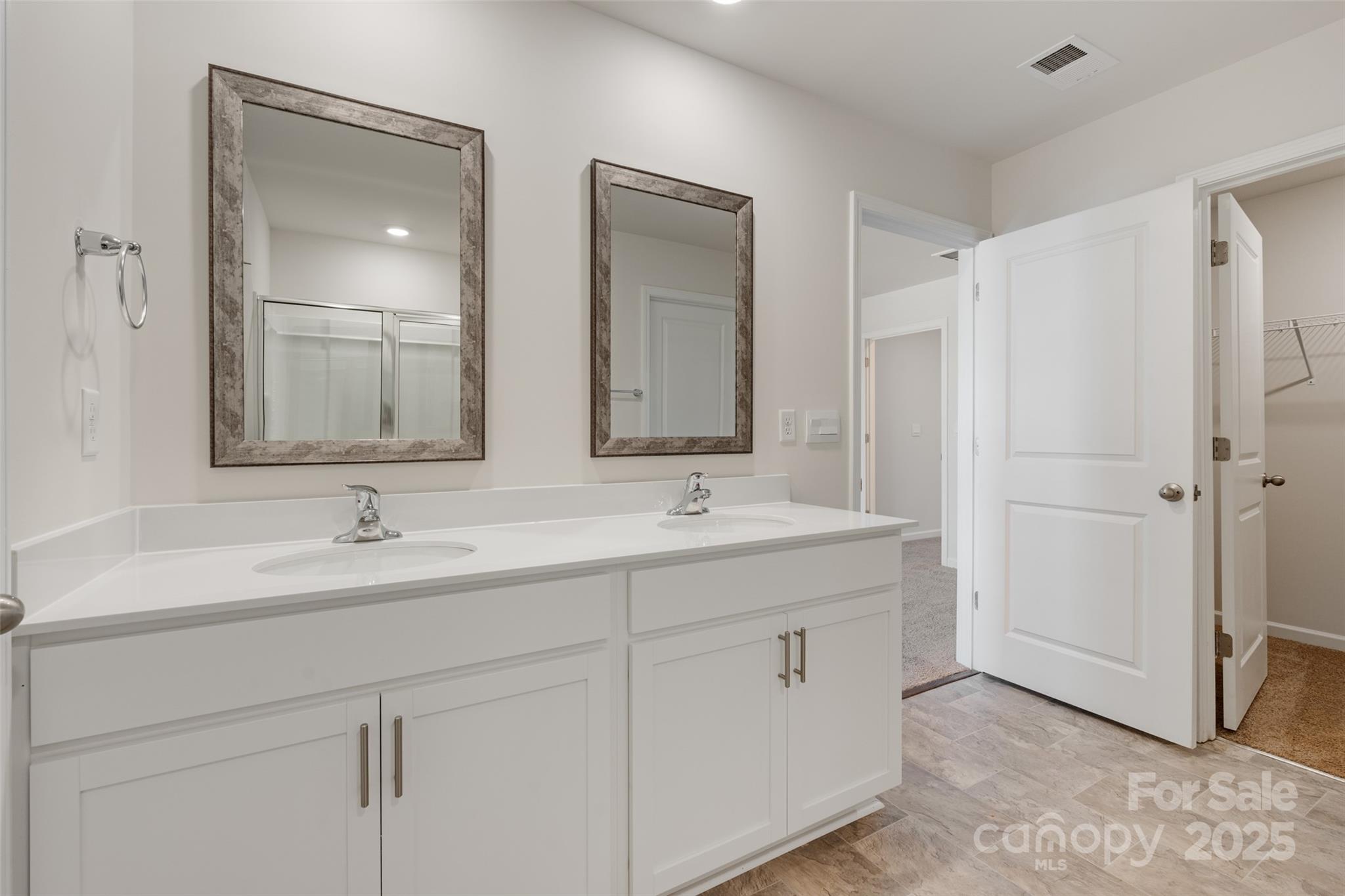 172 Callie River Clyde, NC 28721 - Photo 16 of 21 a bathroom with 2 sink and a mirror