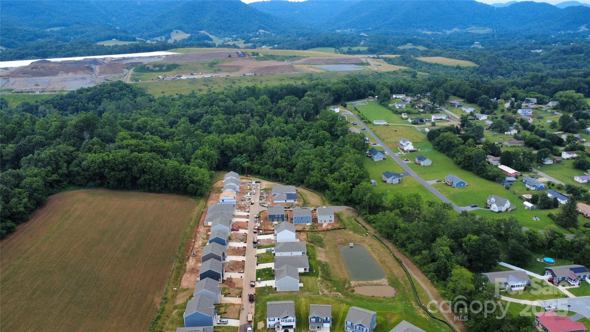 172 Callie River Clyde, NC 28721 - Photo 2 of 21 an aerial view of residential houses with outdoor space and trees