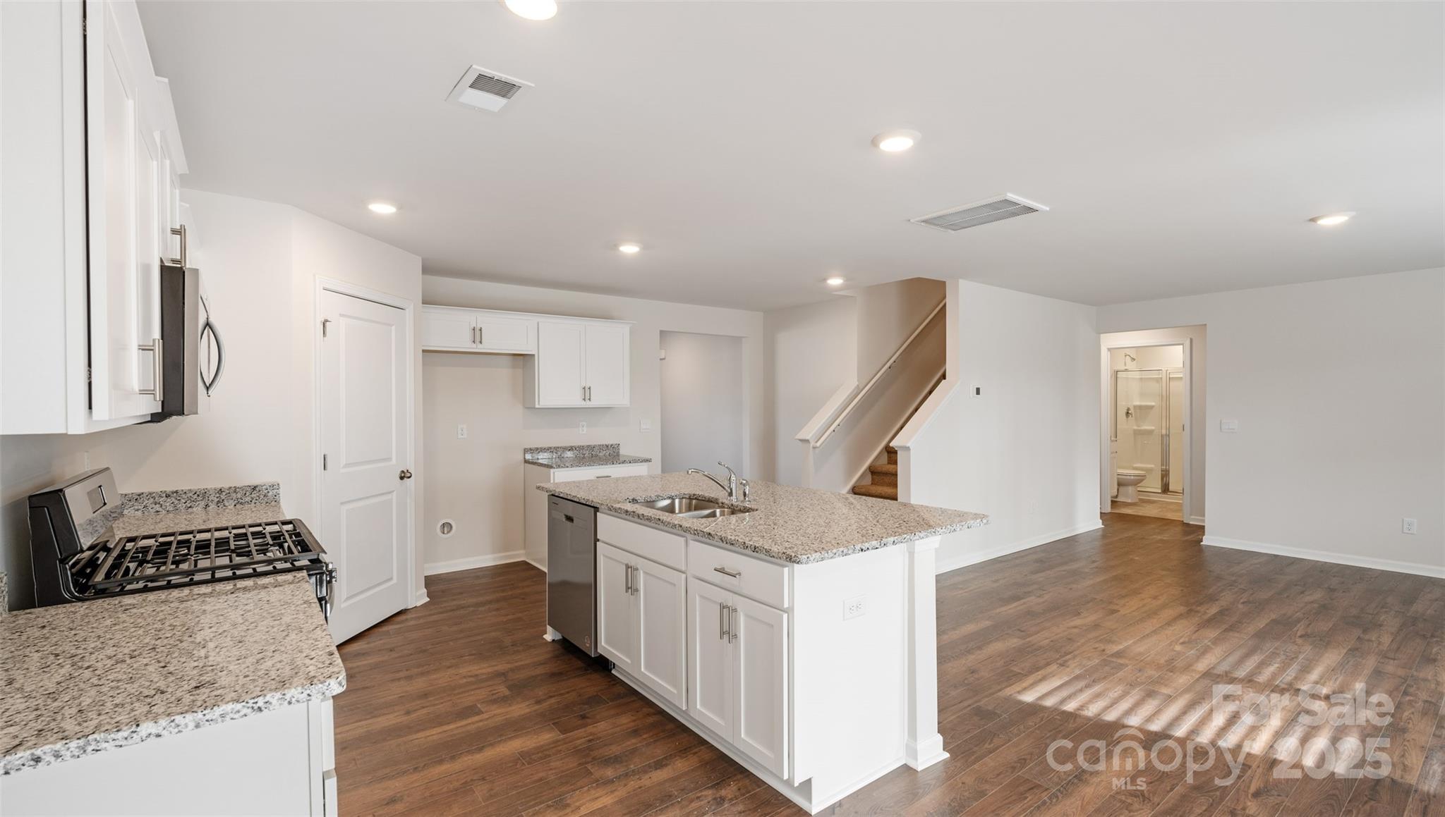 172 Callie River Clyde, NC 28721 - Photo 5 of 21 a kitchen with a stove and a refrigerator