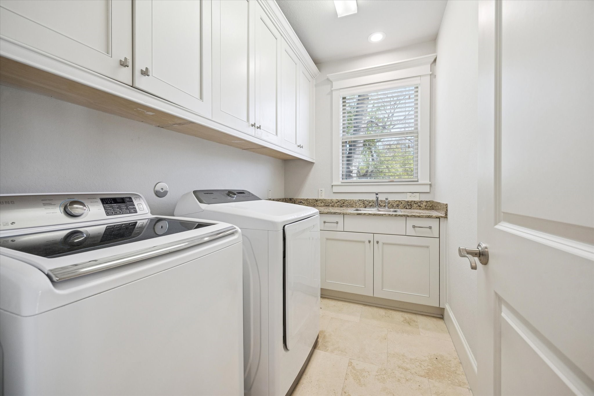 1802 Wakefield Drive Houston, TX 77018 - Photo 37 of 47 Bright laundry room complete with ample cabinets providing plenty of storage.
