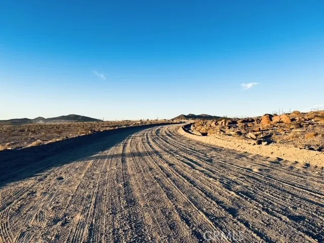 a view of a large body of water and mountain