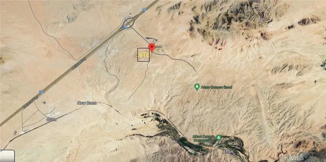 a picture of white wall with a white vase and flowers on it