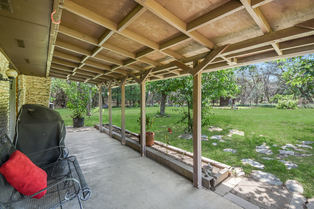 301 Navajo Trail Georgetown, TX 78633 - Photo 35 of 35 View of patio with grilling area and view of wooded area