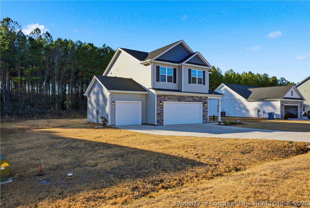 106 Knotts Berry Road Bunnlevel, NC 28323 - Photo 3 of 50 a front view of a house with a yard