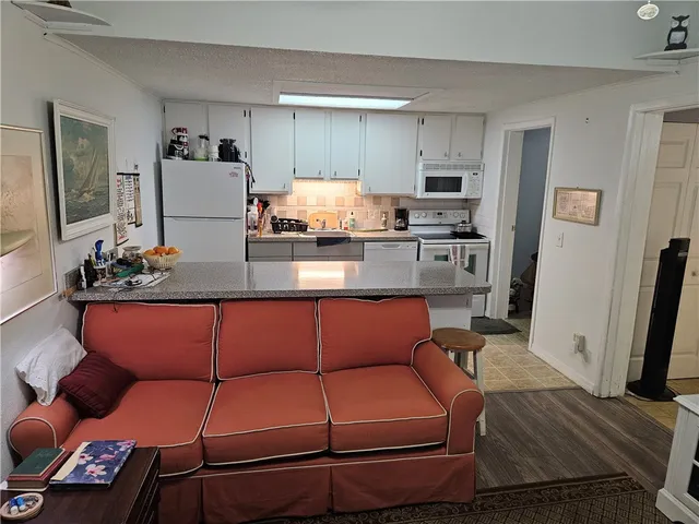 a kitchen with stainless steel appliances wooden cabinets and a counter top space