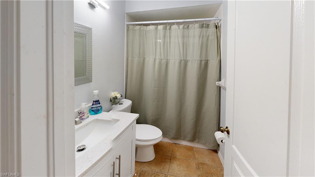 2801 46th Street Southwest Naples, FL 34116 - Photo 31 of 50 Bathroom with vanity, toilet, and tub shower combo