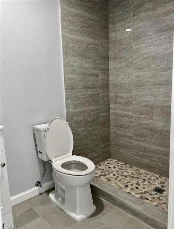 2801 46th Street Southwest Naples, FL 34116 - Photo 41 of 50 Efficiency bathroom with tiled shower and toilet