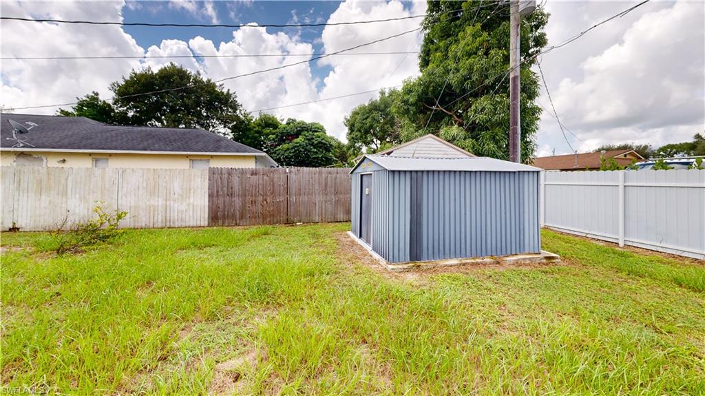 2801 46th Street Southwest Naples, FL 34116 - Photo 44 of 50 View of yard featuring a storage shed