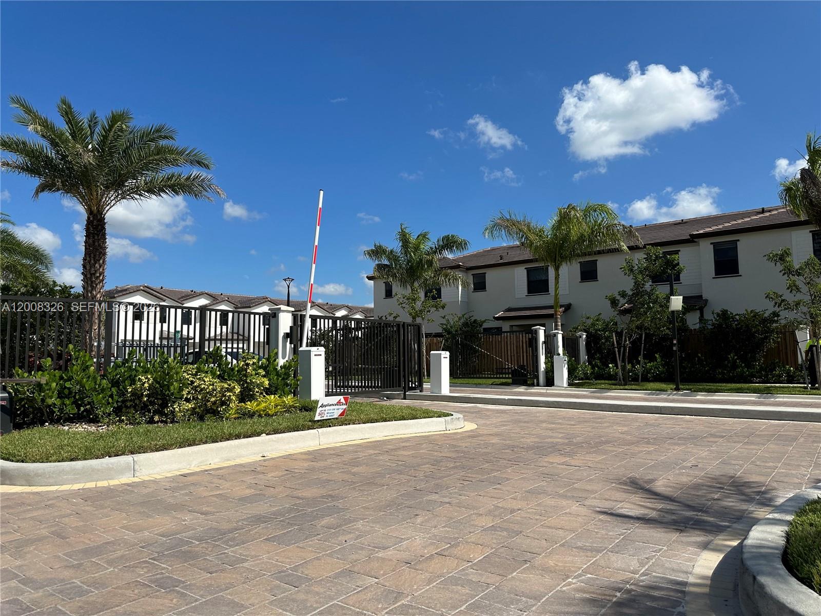261 Southwest 159th Way Pembroke Pines, FL 33027 - Photo 15 of 17 a front view of a house with a yard and garage