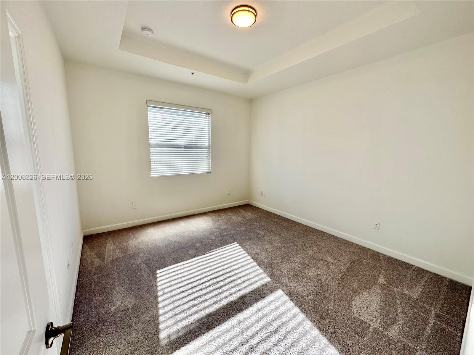 261 Southwest 159th Way Pembroke Pines, FL 33027 - Photo 7 of 17 a view of an empty room and window