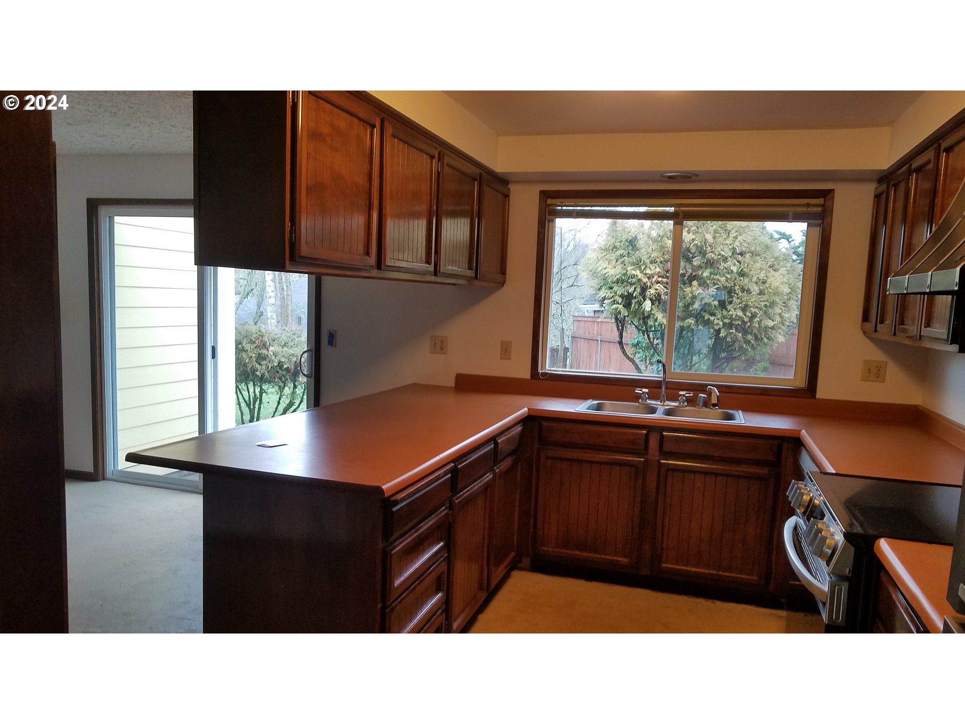 3324 Northeast 162nd Street Ridgefield, WA 98642 - Photo 27 of 37 a kitchen with a sink a window and a table