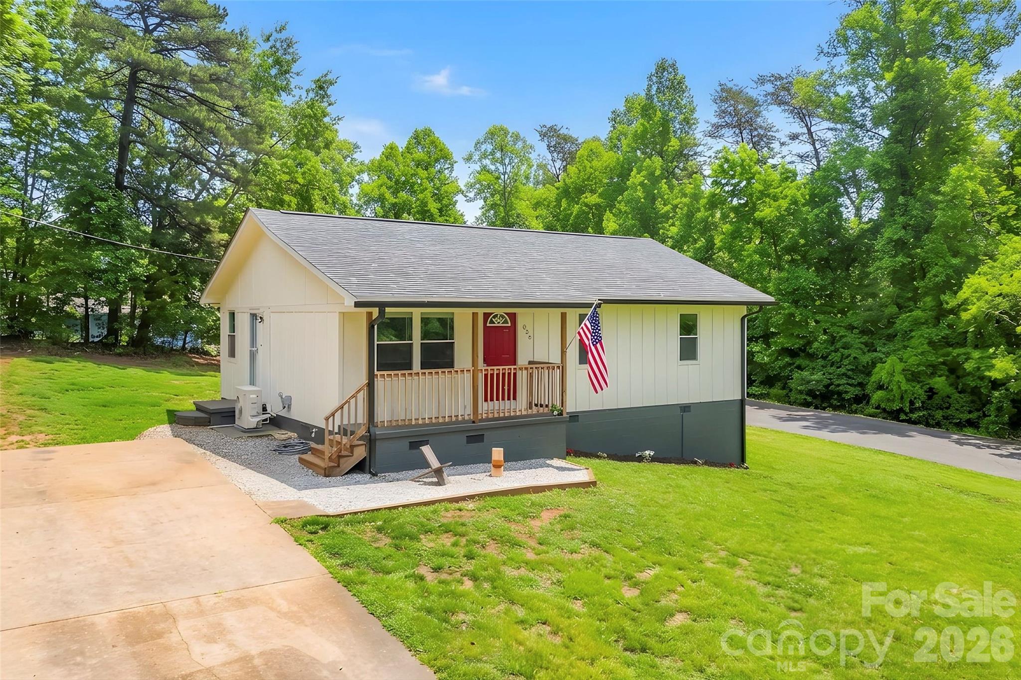 825 South Creek Road Nebo, NC 28761 - Photo 3 of 34 a front view of house with yard and outdoor seating