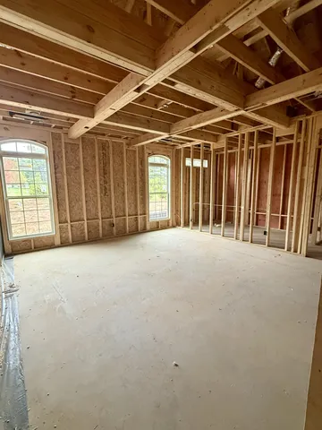 a view of an empty room with windows