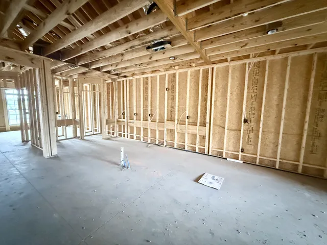 a view of an empty room with stairs